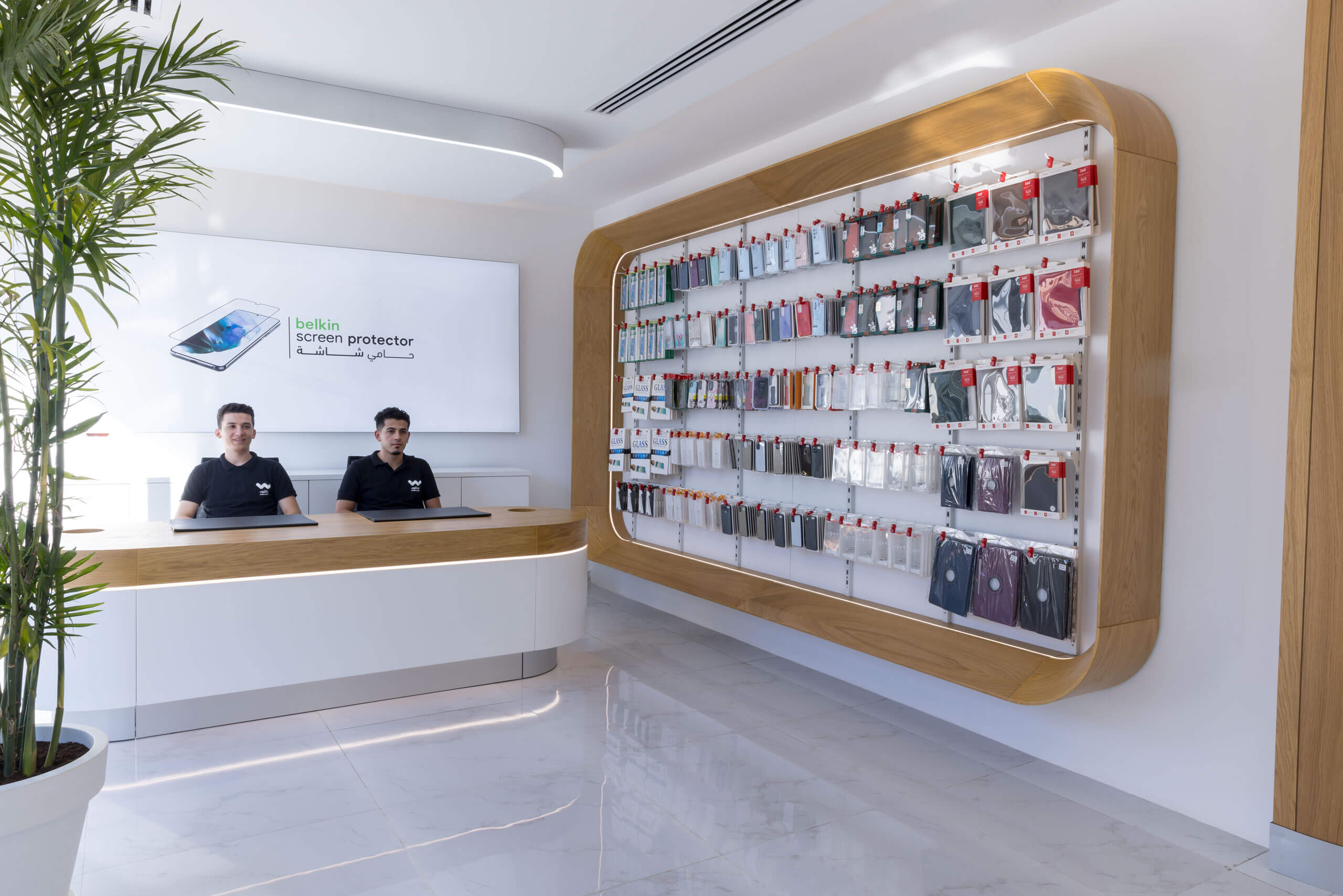 Al Watikon store interior: twin product walls framed in timber with curved white counters