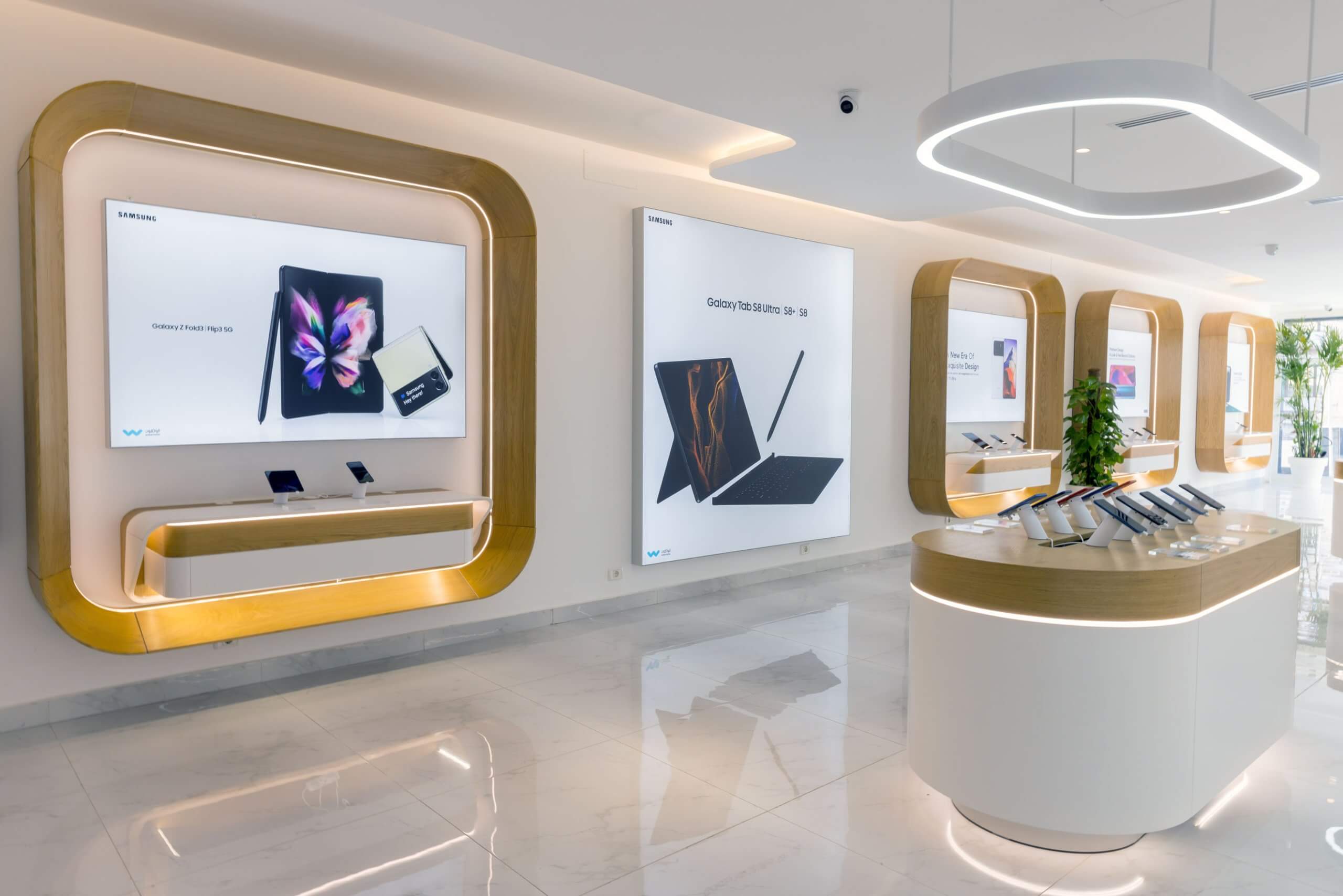Al Watikon store interior: product displays set into curved timber frames