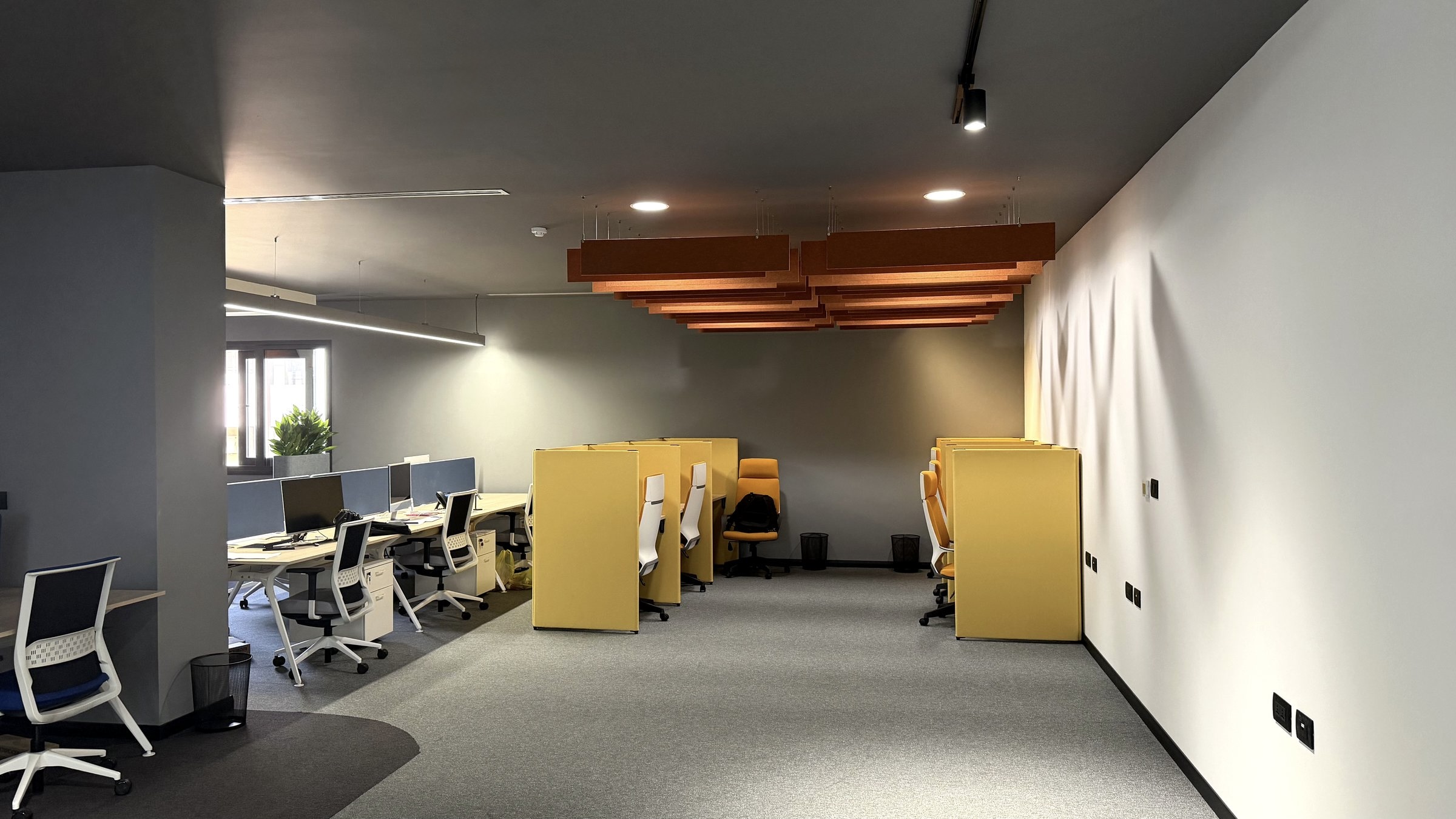 Photo: focus booths as built, under the copper acoustic baffles