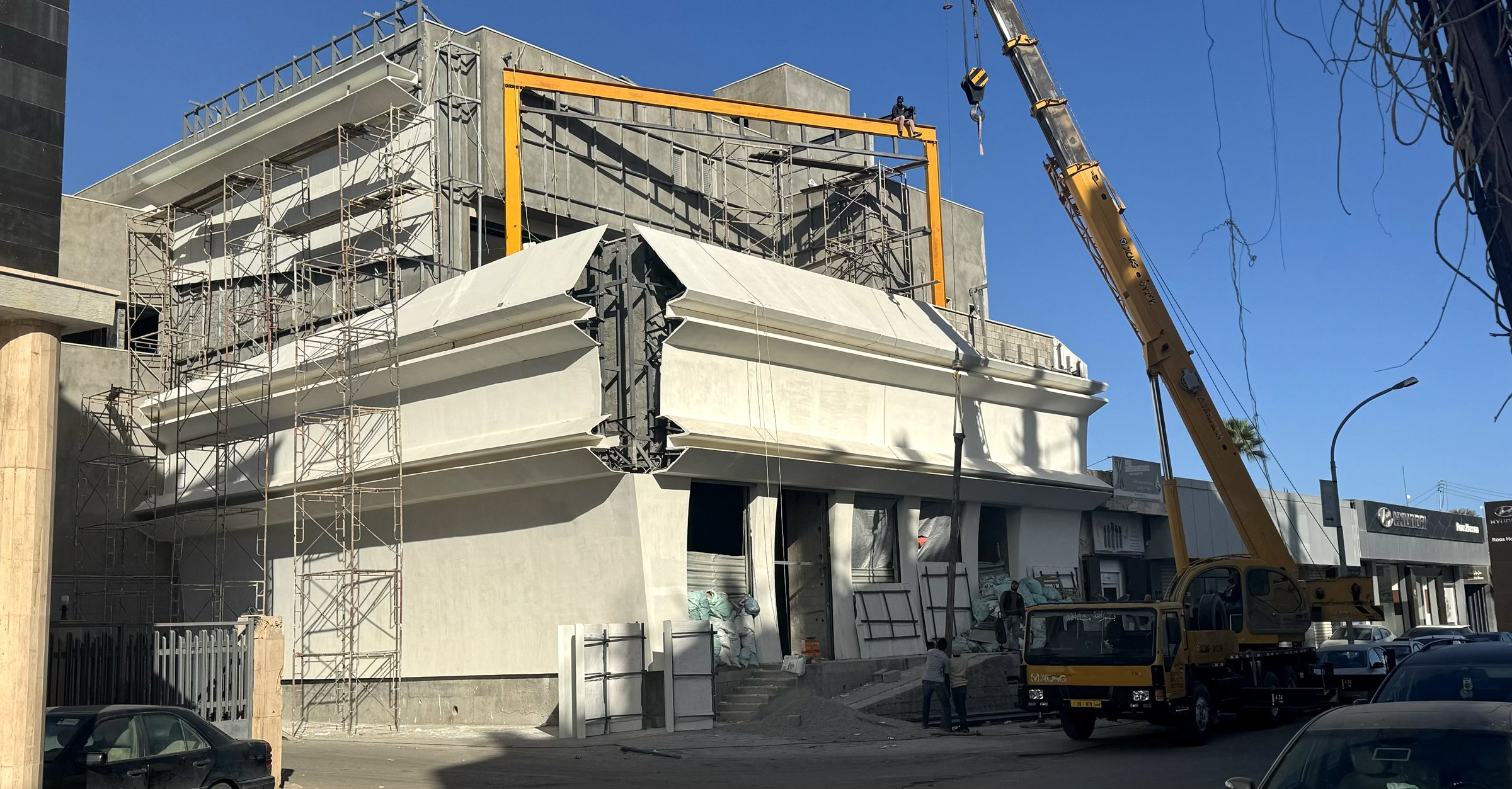 Photo: facade under construction, new panels being installed